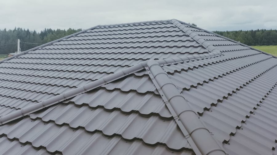 Standing seam metal roofing installation on commercial building