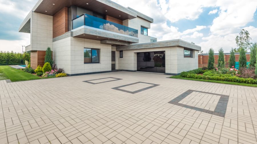 Residential paving services with newly finished asphalt driveway